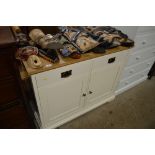 A cream painted and oak top sideboard fitted two d