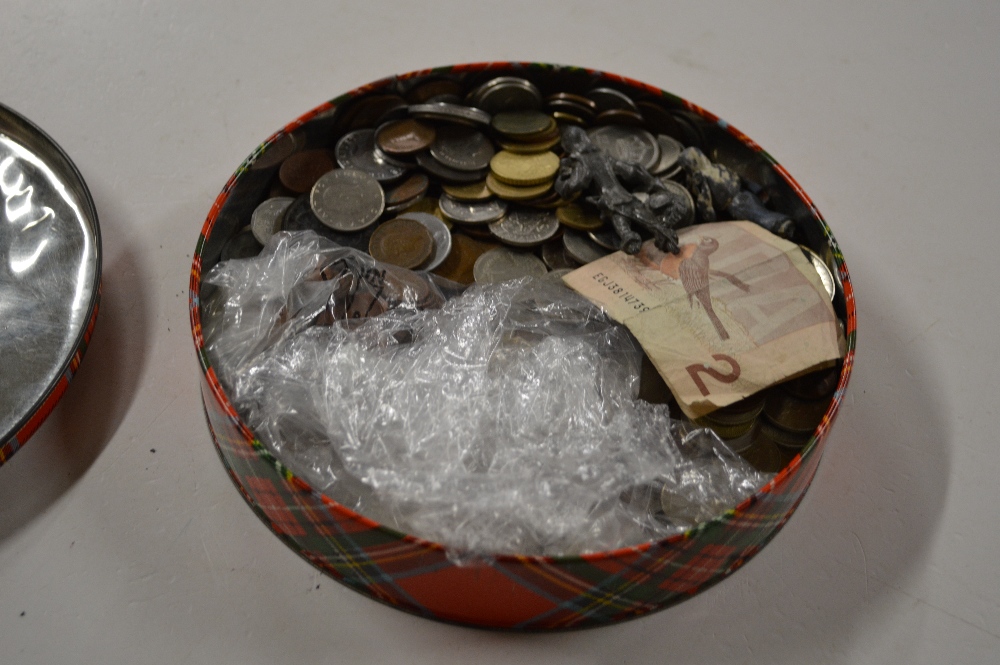 A tin of various coinage