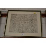 A framed and glazed black and white map depicting