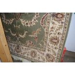 An approx. 9'6" x 6'7" floral patterned rug