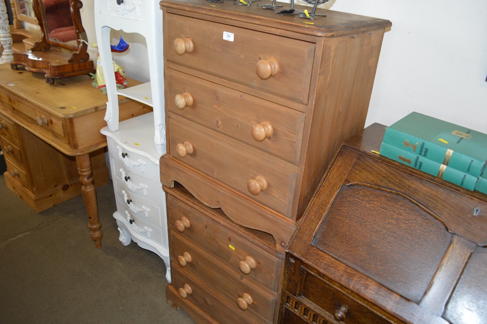 A pair of pine bedside chests fitted three drawers