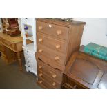 A pair of pine bedside chests fitted three drawers