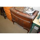 A mahogany bow fronted record player cabinet