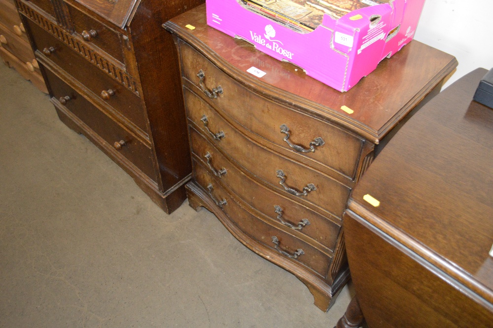 A reproduction mahogany chest fitted four drawers