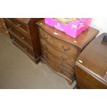 A reproduction mahogany chest fitted four drawers
