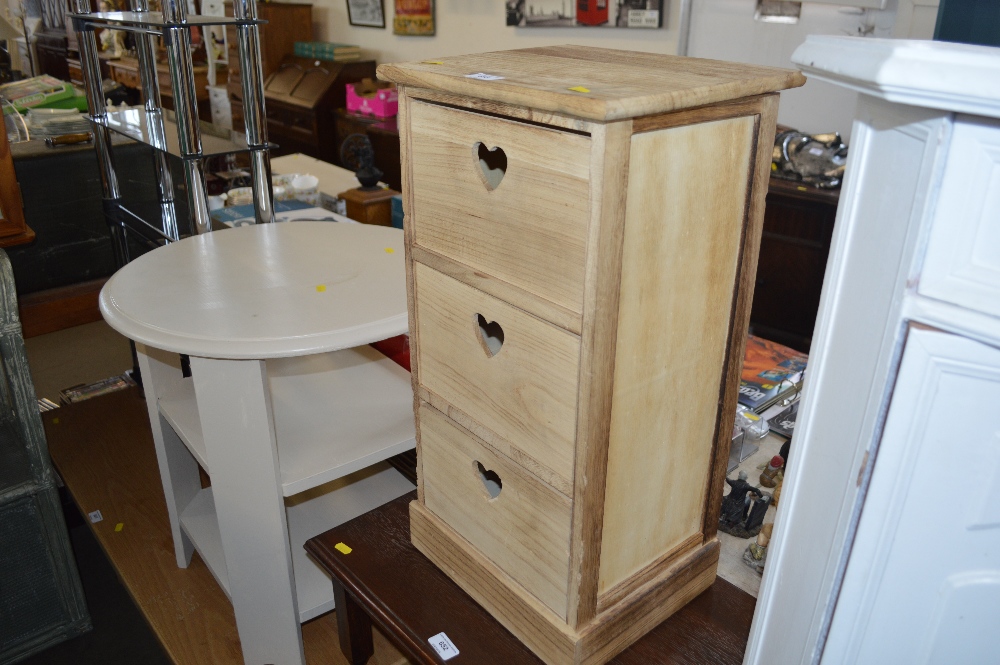 A wooden chest fitted three drawers