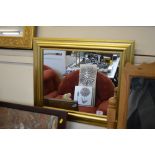 A gilt framed oblong wall mirror