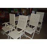 A large white painted garden table with a Lazy Sus