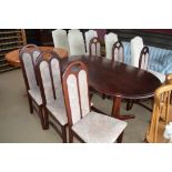 A reproduction mahogany oval topped dining table w