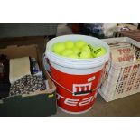 A bucket of Wilson training tennis balls