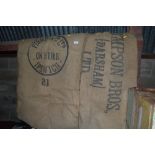 Two local advertising hessian sacks