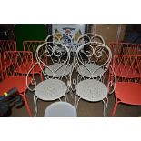 A set of four painted metal chairs