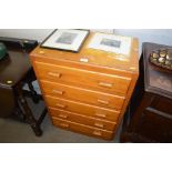 A teak chest fitted five drawers