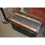 A wooden and metal bound trunk