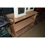 A stripped mahogany open fronted shelving unit