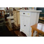 A white painted side cupboard fitted single drawer