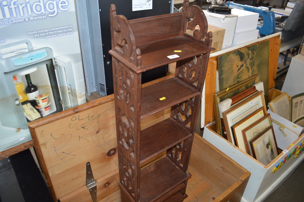 A mahogany bookcase of narrow proportions