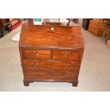 A Georgian mahogany bureau fitted two short and tw