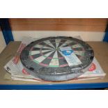 A dartboard with original box