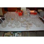 A quantity of cut glass glasses; various glass vas