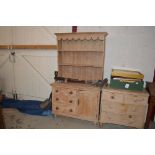 A stripped pine kitchen dresser