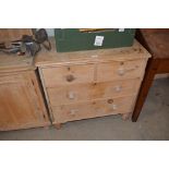 A stripped pine chest of two long and two short dr
