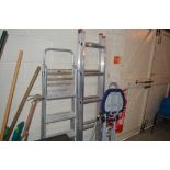 A small set of extending aluminium ladders; and a