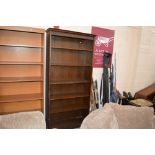 A set of tall oak book shelves