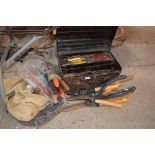 A metal tool box and contents; other and tools and