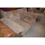 A modern leather and upholstered two seater sofa bed