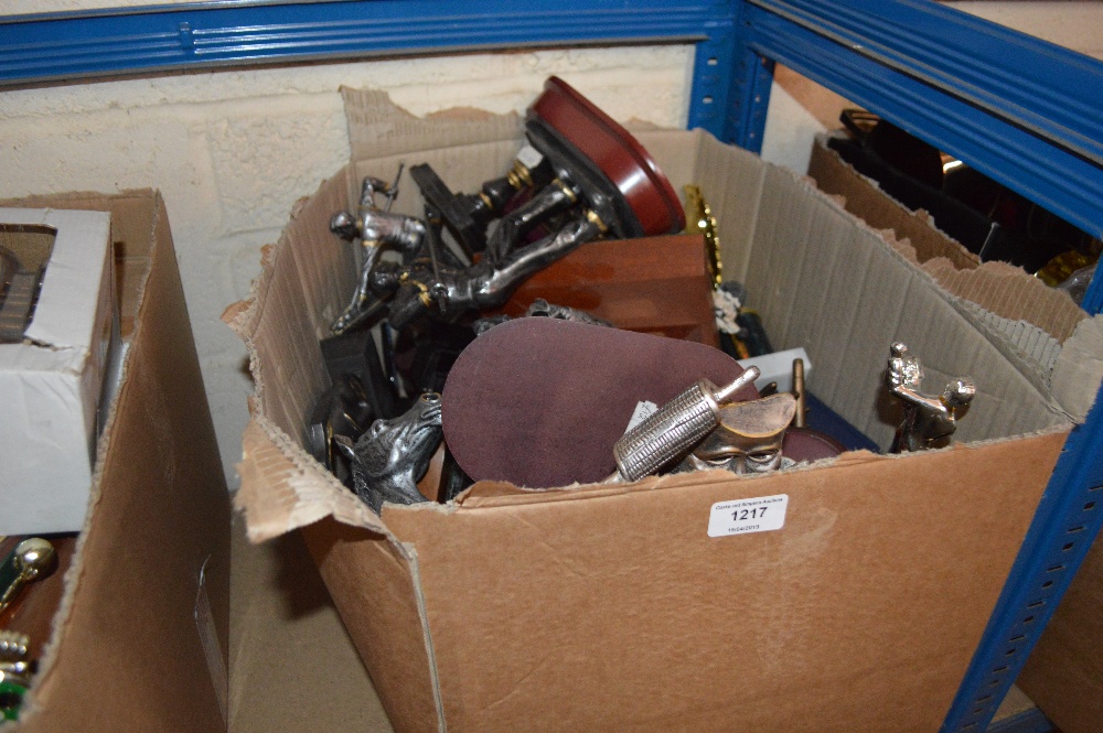 A box of various snooker and other sports trophies