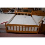 A modern 4'6" pine framed double bed and mattress