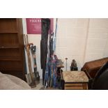 A quantity of fishing rods, rod rests etc.