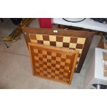 An inlaid games table with chequer board top; and