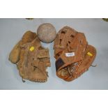 Two Vintage baseball gloves and a ball