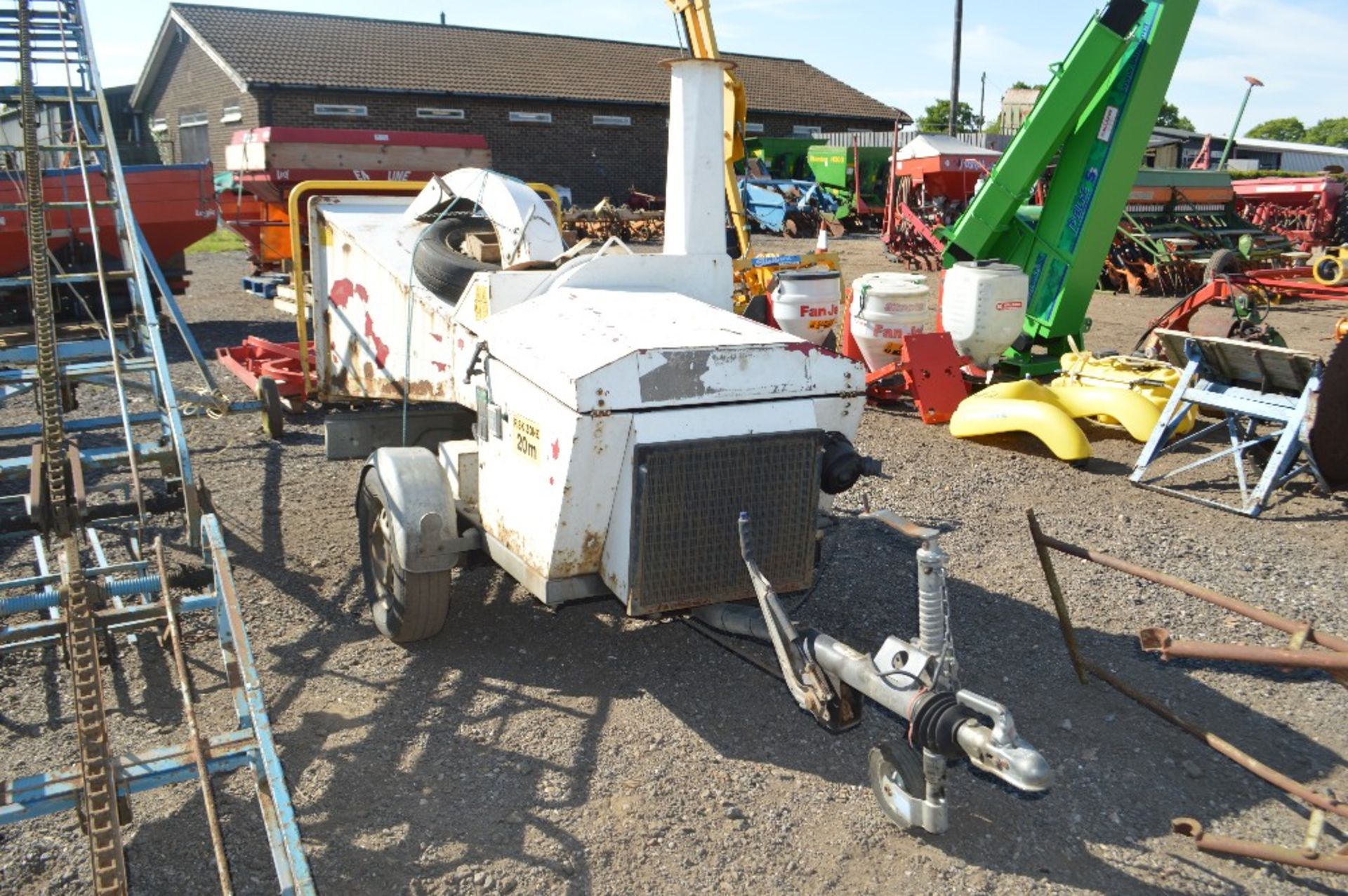 Commercial woodchipper on single axle fast tow chassis. Vendor reports engine requires repair/