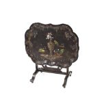 A Victorian papier mache folding tray table, decorated with exotic birds and foliage, heightened