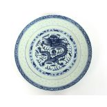 A quantity of 20th Century Chinese blue and white dinnerware, decorated dragons and clouds; together