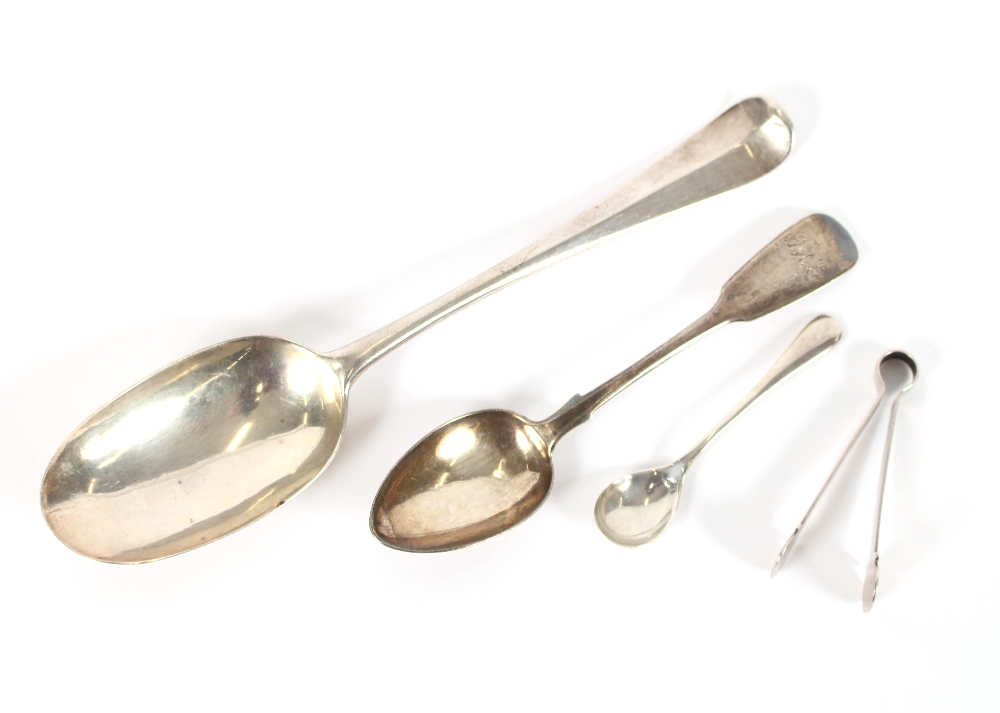 A George III silver spoon, 1814; a George III pair of silver miniature tongs, London 1813; and a