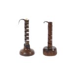 Two 18th Century walnut based iron spiral candlesticks, of typical form, 19cm high