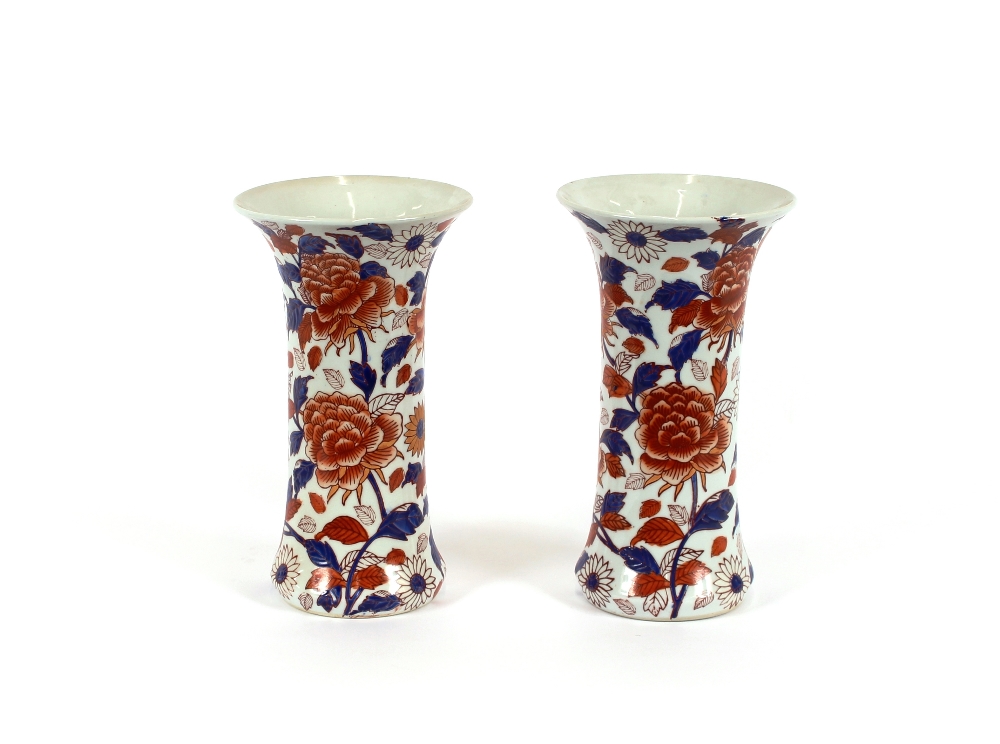 A pair of 19th Century Japanese Imari vases, of waisted form, decorated foliage, 30cm high