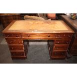 A Victorian mahogany pedestal writing desk, the leather inset top above three frieze drawers, with