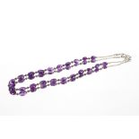 A silver and amethyst set necklace