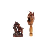 A 19th Century treen nutcracker, carved as a squirrel sitting on a post 19cm long; and a 19th