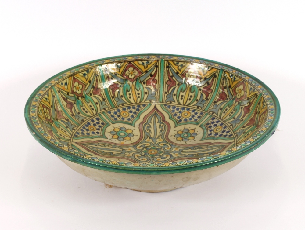 A large brightly coloured Iznic pottery bowl, having all over stylised decoration, 49.5cm dia. - Image 2 of 3