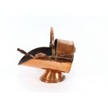 An Antique copper coal scuttle and scoop
