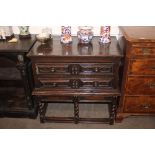 A Jacobean chest on stand, fitted two geometric moulded panelled drawers, the base raised on