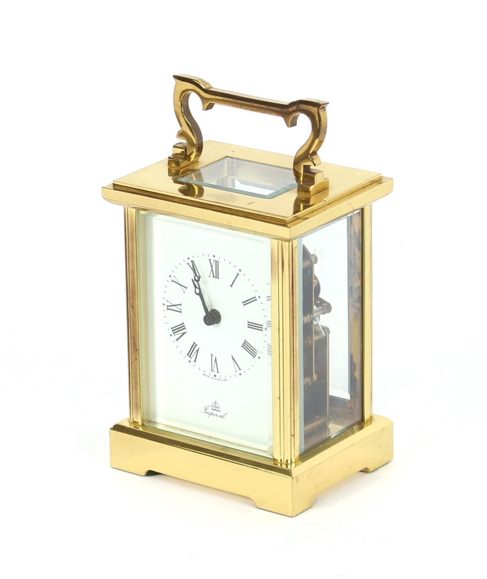 A brass cased carriage clock, with white enamel dial, signed Imperial, platform escapement, 13 jewel