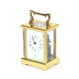 A brass cased carriage clock, with white enamel dial, signed Imperial, platform escapement, 13 jewel