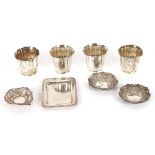 A set of four silver beakers, A & J Zimmerman, Birmingham 1914, fluted and flared, 7ozs, 7cm; a